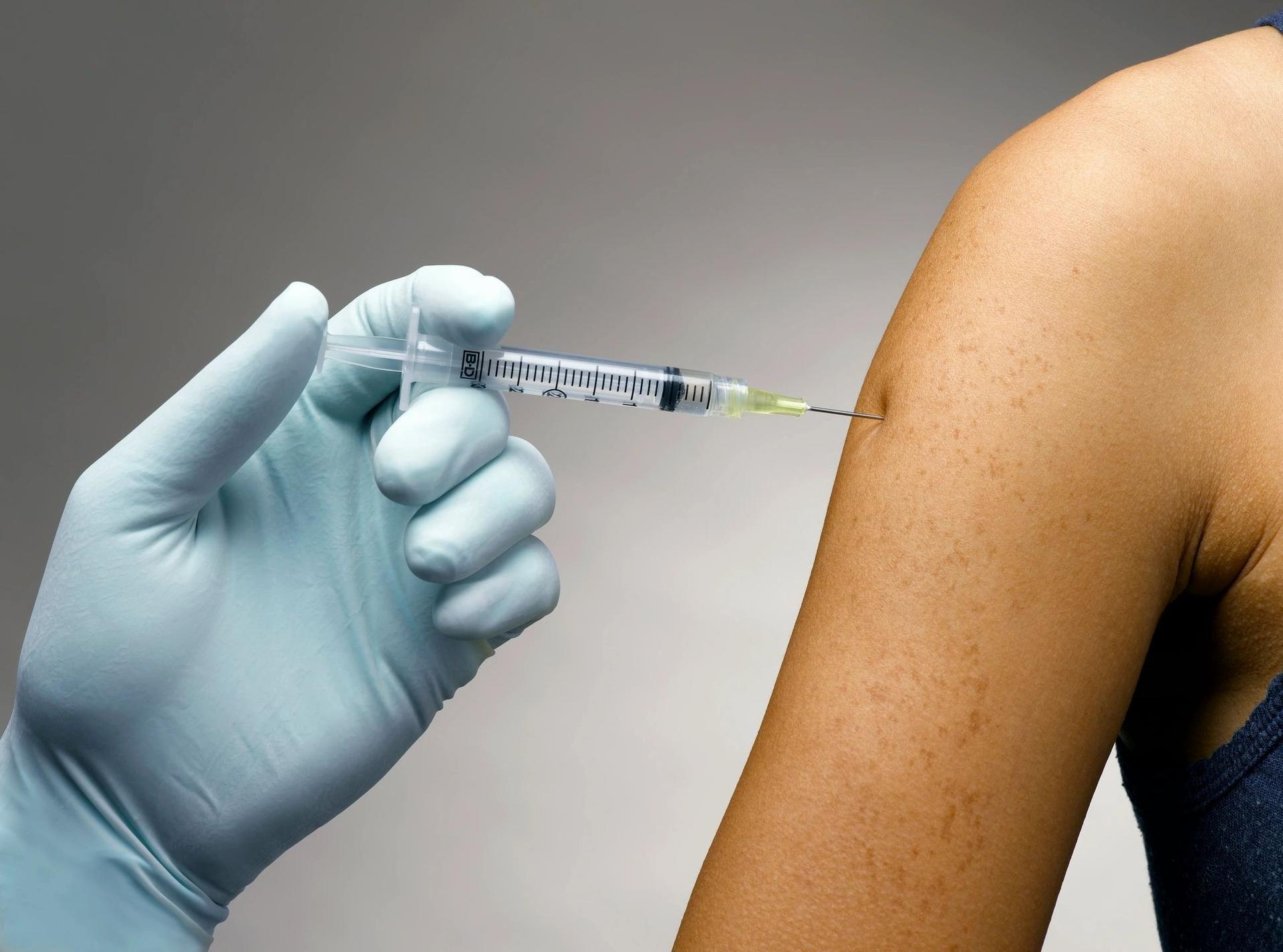 Vitamin injection being administered