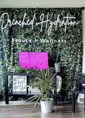 Drenched Hydration Beauty + Wellness photo wall inside the clinic